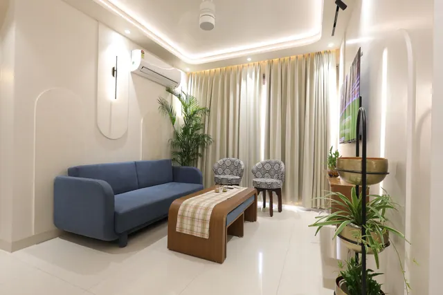 Full view of a drawing room interior in a small apartment, showcasing a well-balanced layout, stylish furnishings, and thoughtful decor elements that maximize the use of space while maintaining an inviting atmosphere